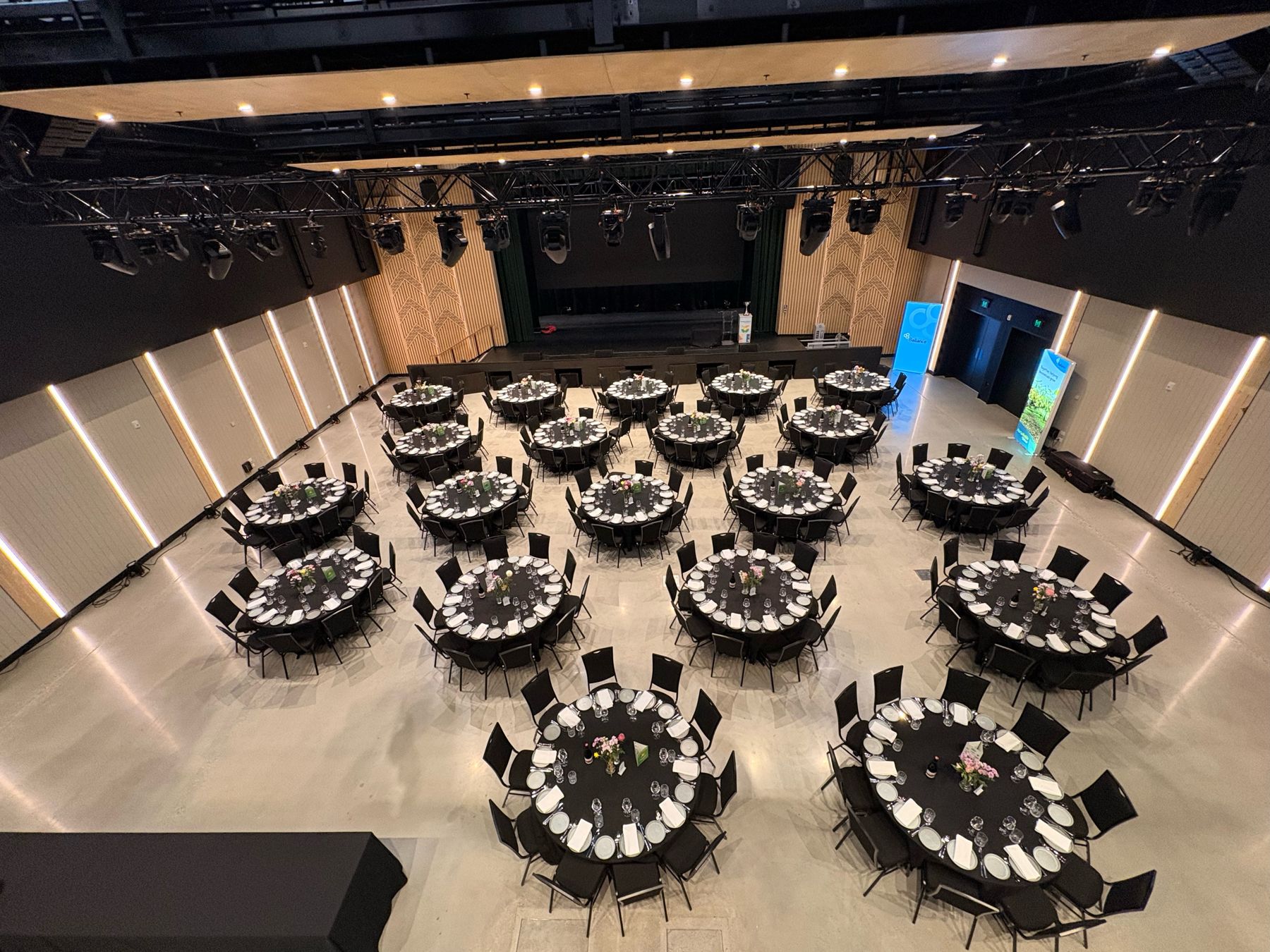 The auditorium set for a seated dinner